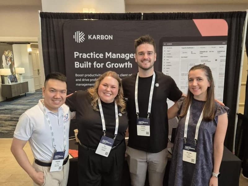 Steven Duc Tran with members of the Karbon team at the Karbon booth, May 2025